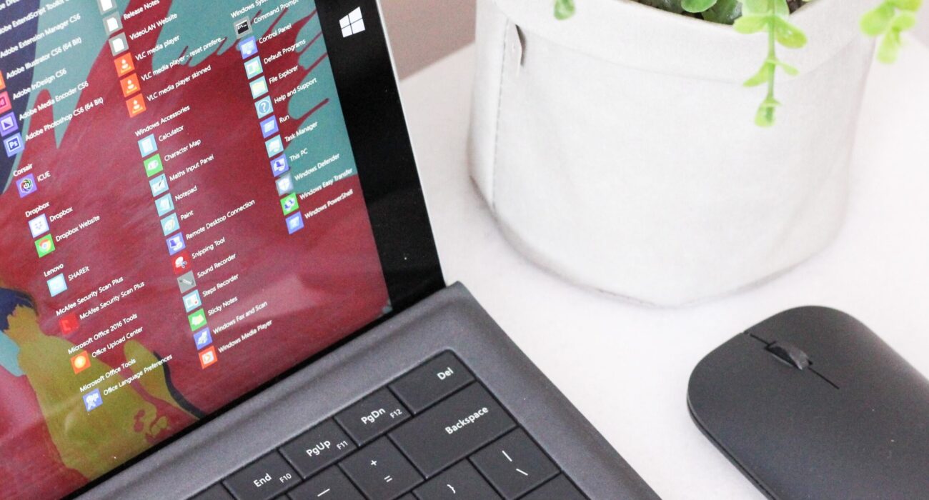 black laptop computer beside black wireless mouse