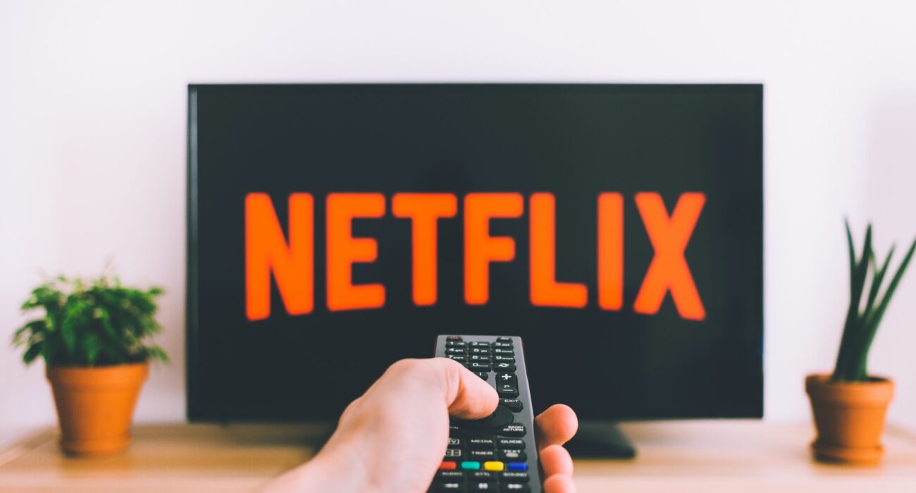 Free Person Holding a Remote Control Stock Photo