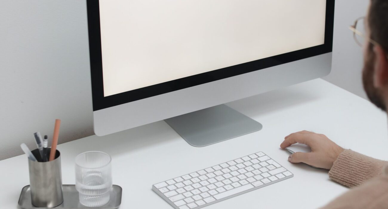 Free Crop man working on computer in workplace Stock Photo