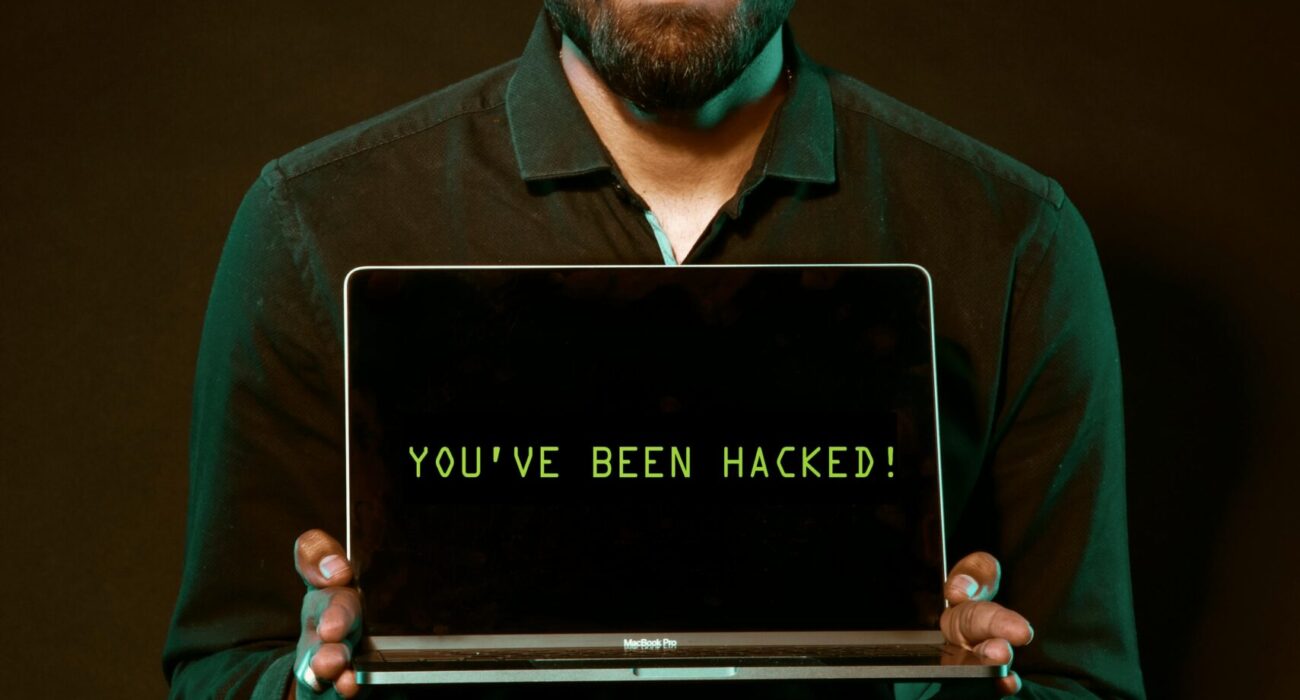 Free Man Holding Laptop Computer With Both Hands Stock Photo